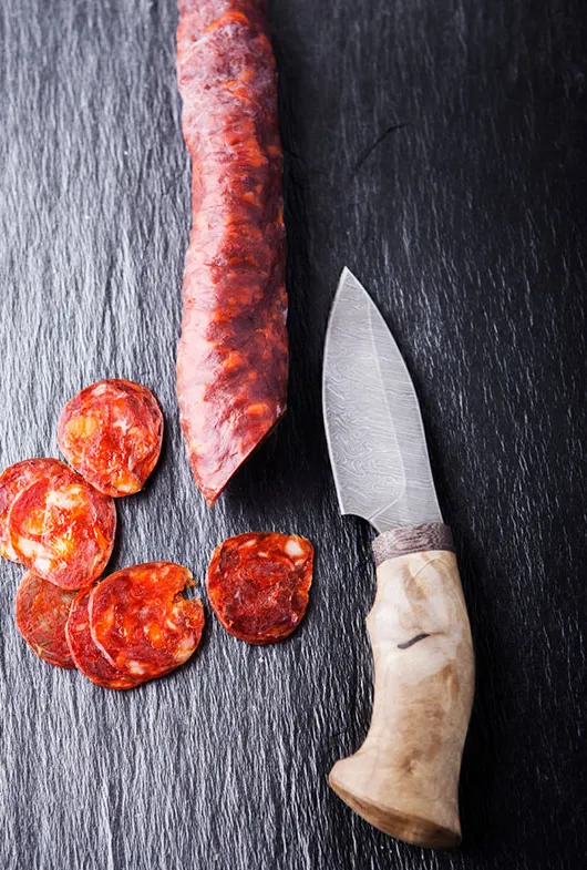 Ambachtelijk bier en chorizo' title='Bier en worst: verbonden door traditie